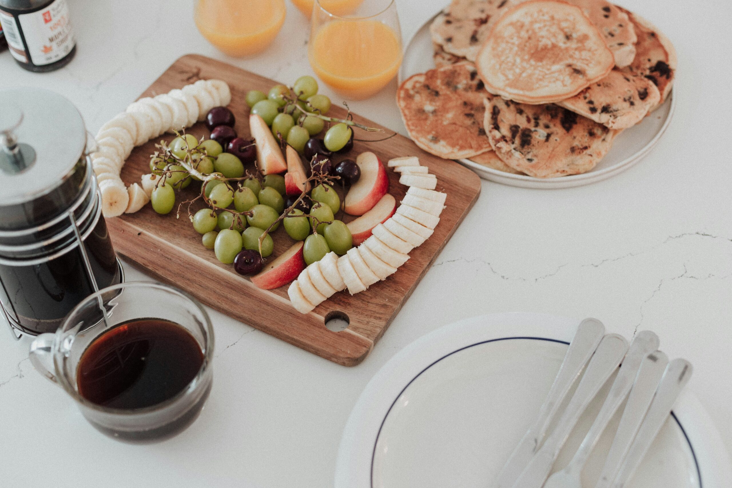 pancake, banana, apple, grapes, coffee
