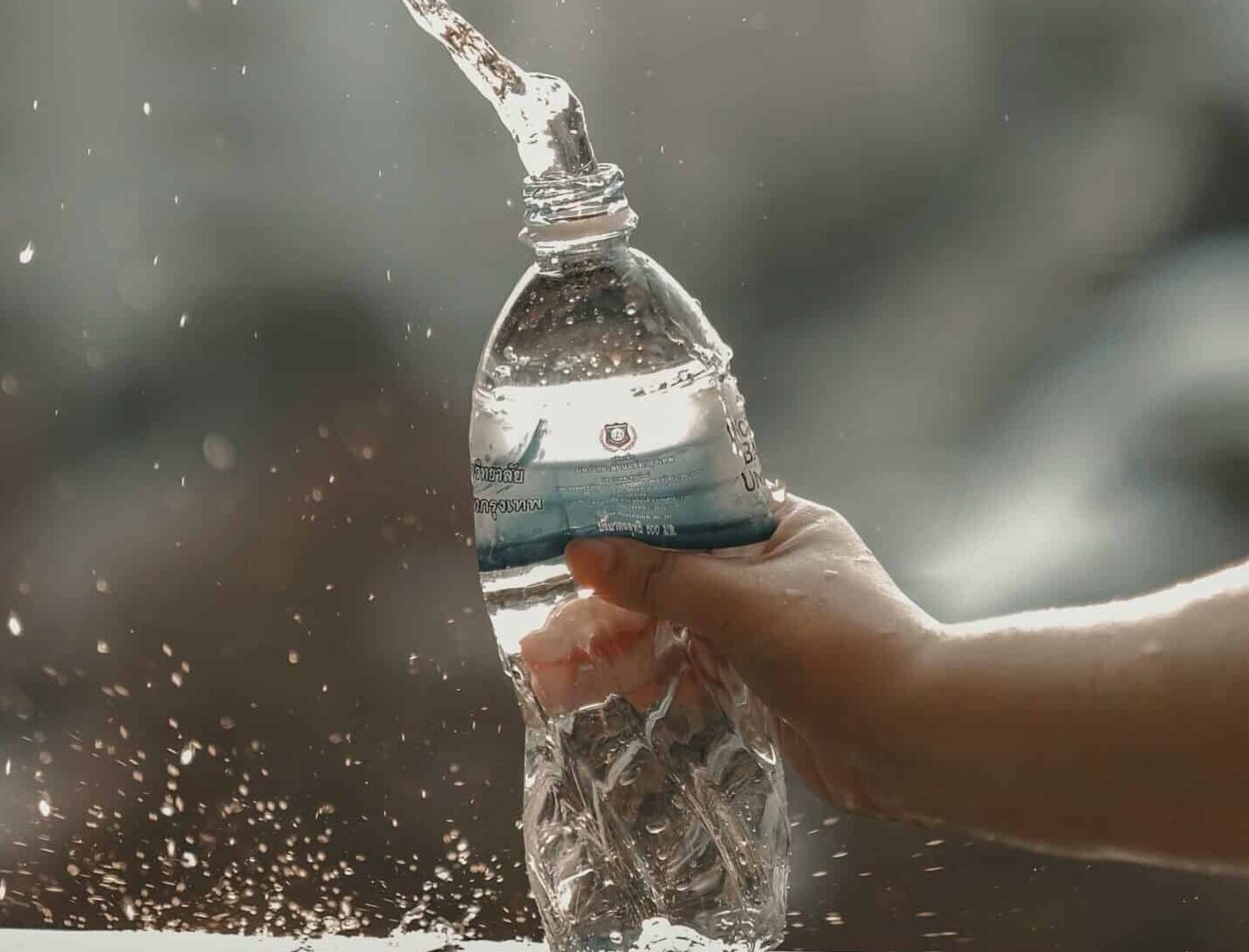 water, a bottle of water splashed