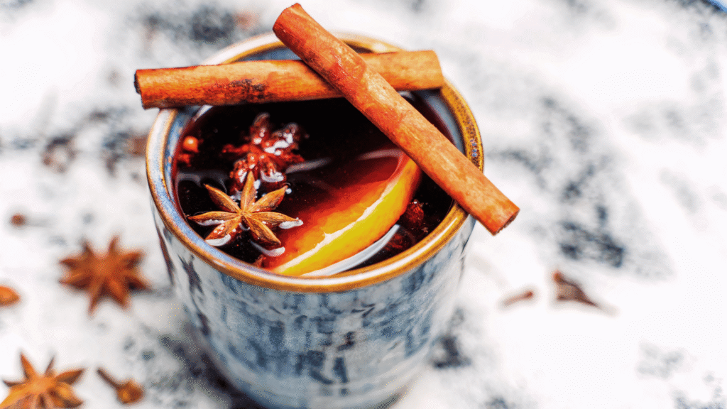 Warm drink with cinnamon infused with dry lemon and star anise