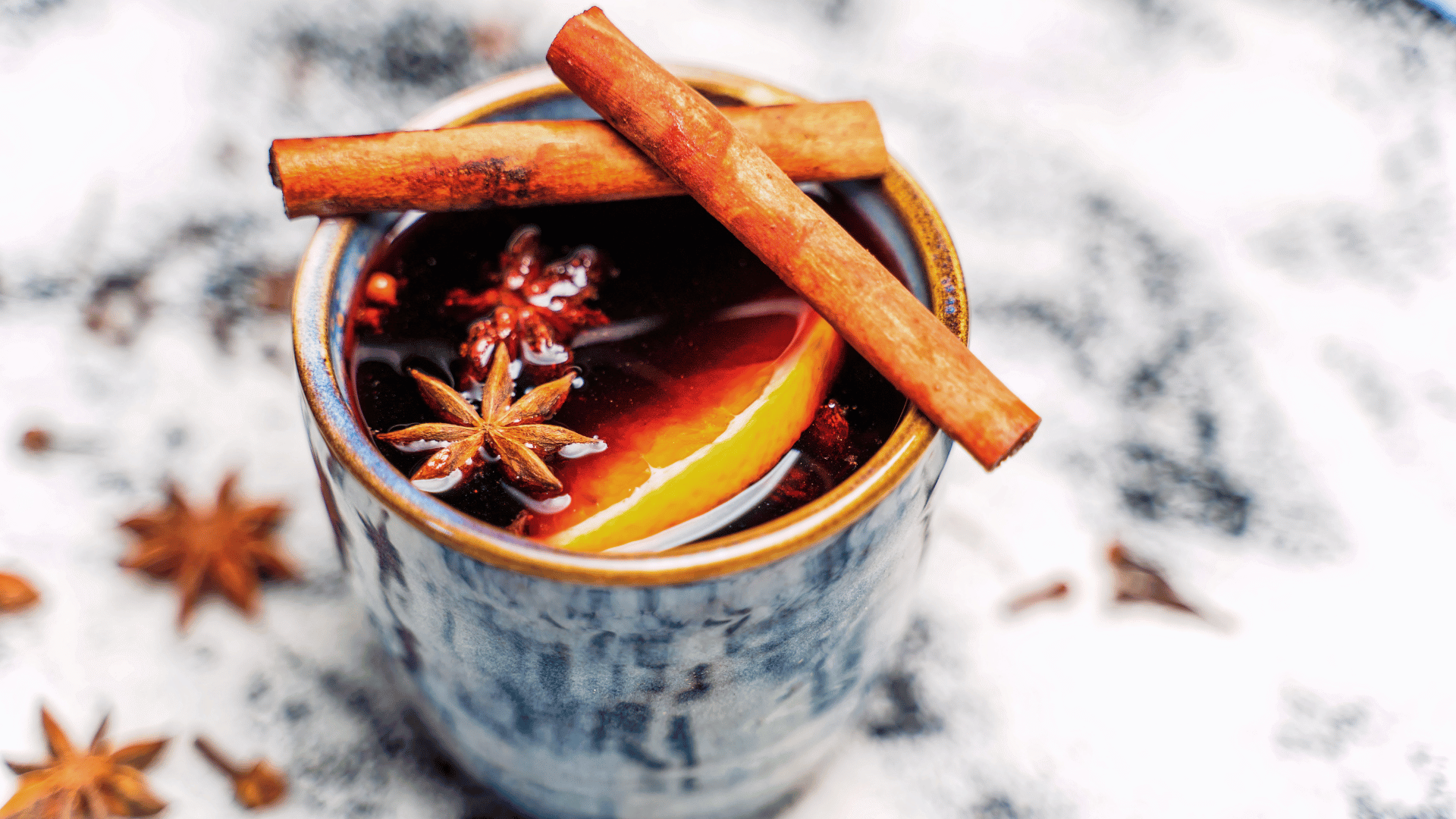 Warm drink with cinnamon infused with dry lemon and star anise