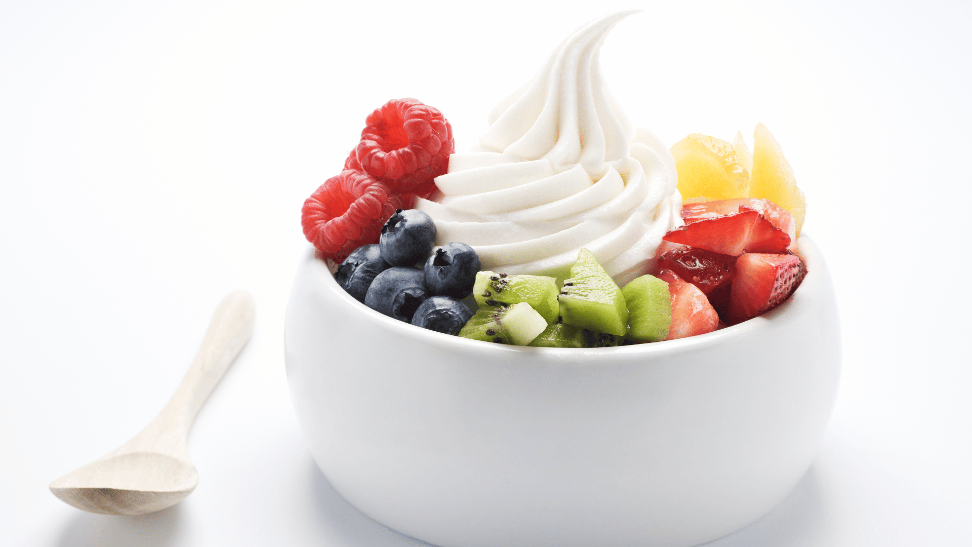 Refreshing frozen yogurt topped with mixed fresh fruits and berries