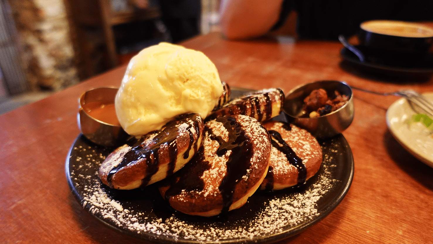 Peanut butter chocolate pancake from The Daily Fix Café in Jonker Street, Melaka fluffy pancake with ice cream, chocolate drizzle, peanut butter, and granola.