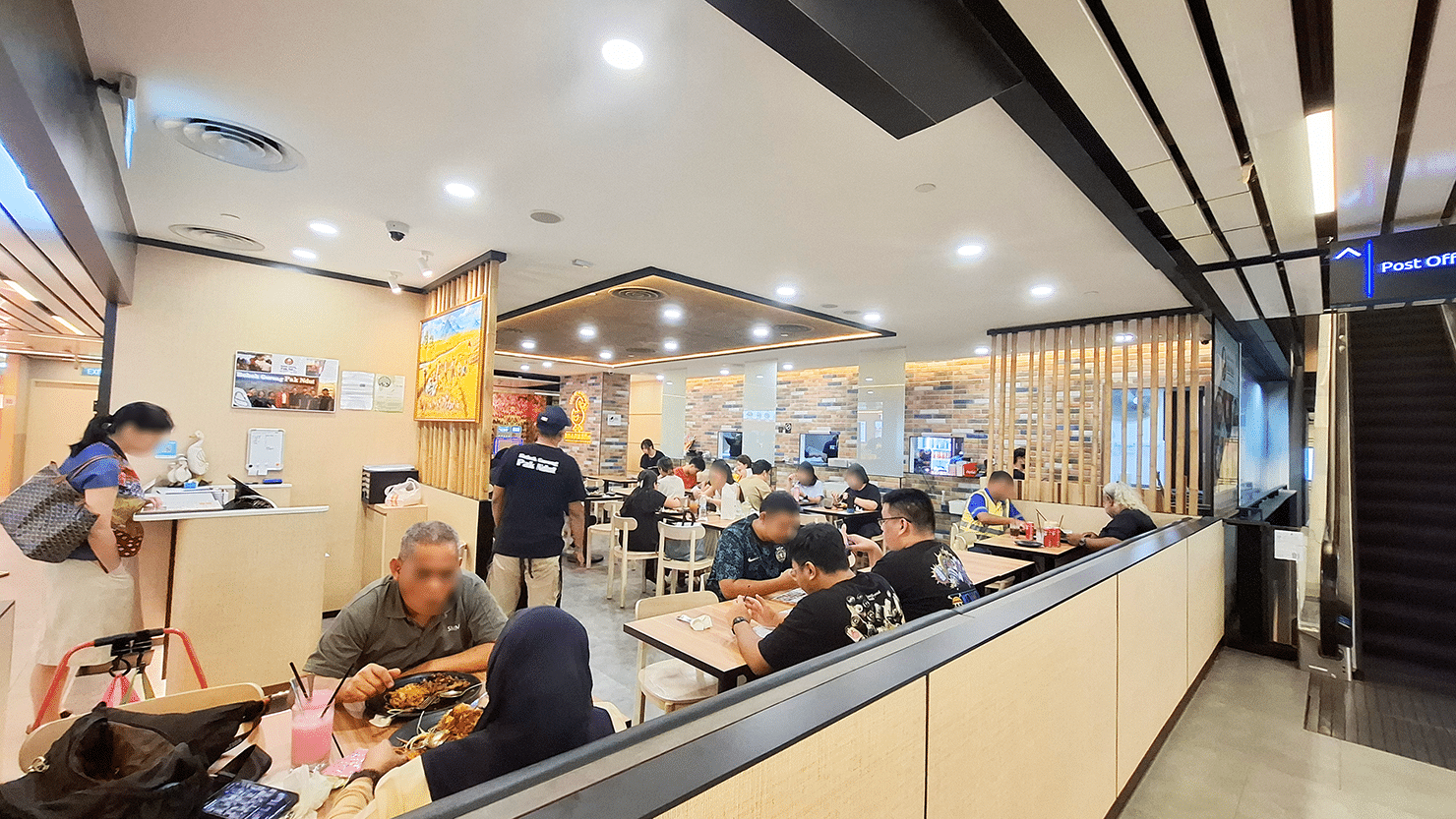 Interior of Bebek Goreng Pak Ndut at SingPost Centre Singapore, casual halal Indonesian restaurant with comfortable seating during dinner hours.