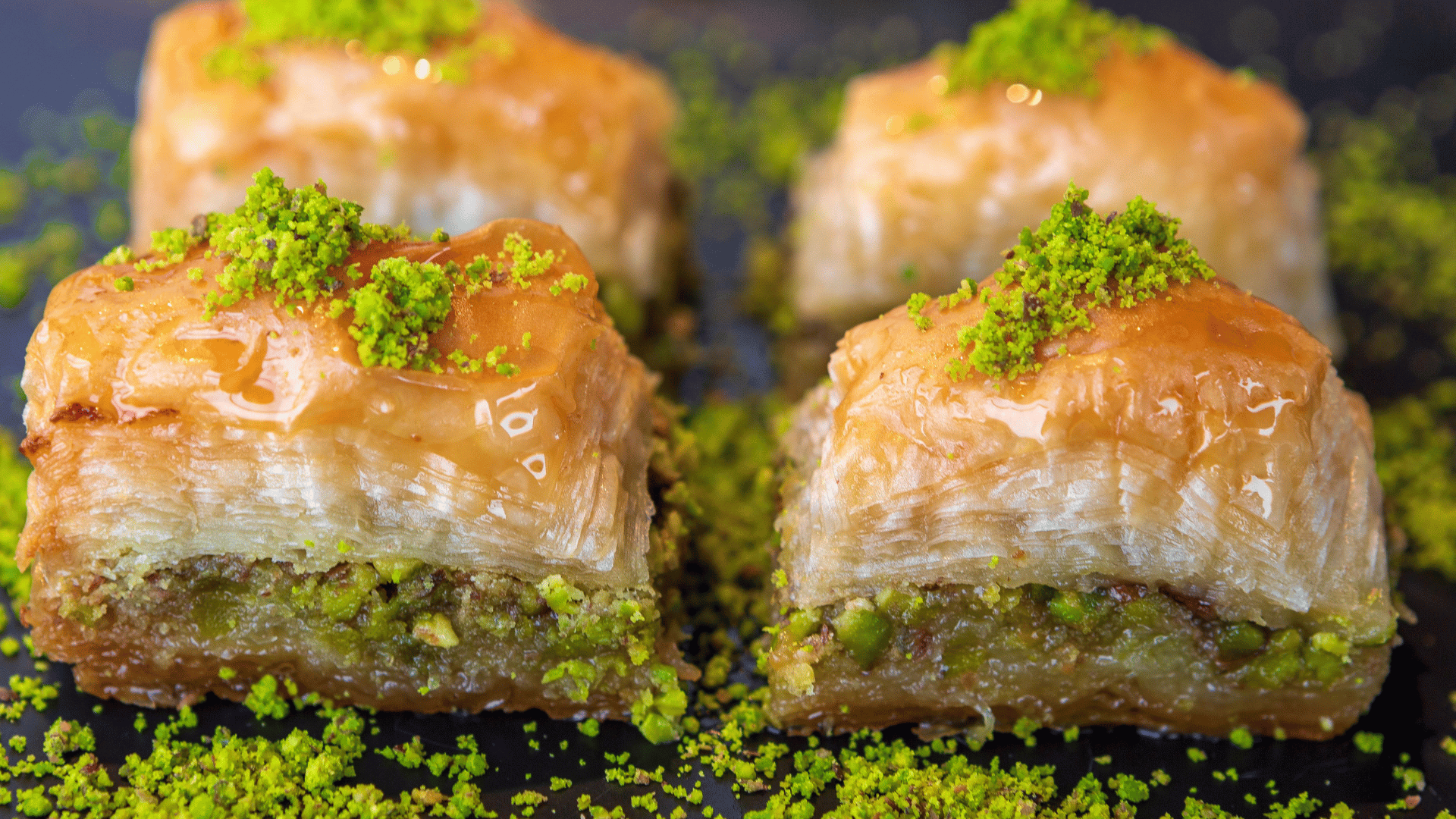 Layered baklava pastry filled with nuts and soaked in syrup, commonly enjoyed during Ramadan and Eid
