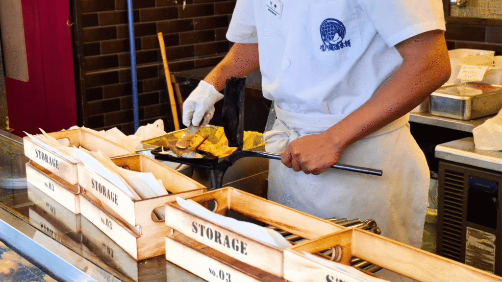 Traditional taiyaki being cooked one by one at Naruto Taiyaki Hompo Namba