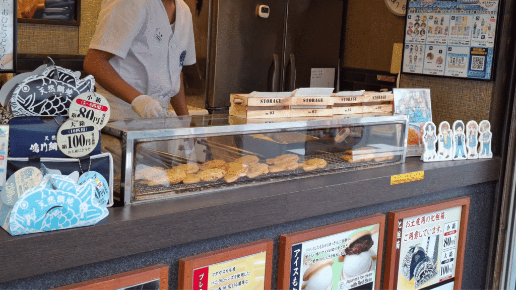 Traditional taiyaki being cooked one by one at Naruto Taiyaki Hompo Namba