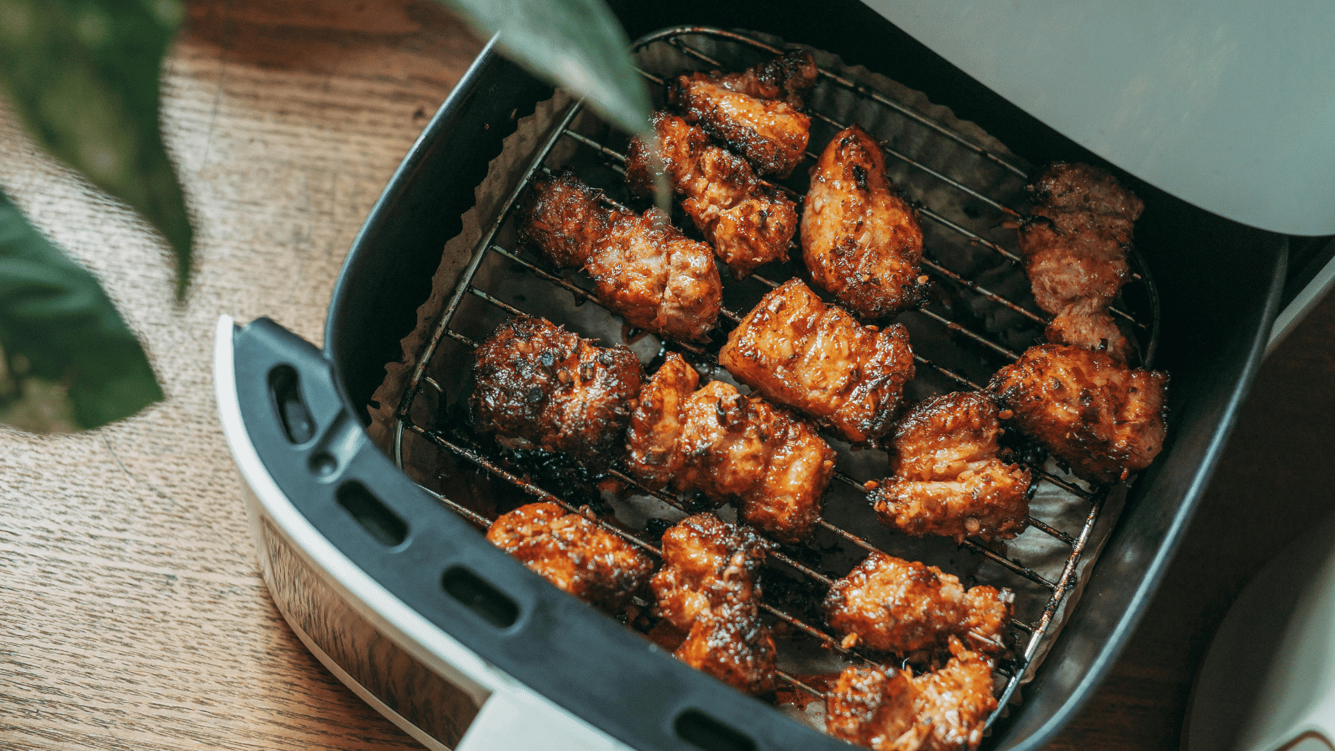 Air fryer with double rack accessory used to cook multiple foods at once without overcrowding